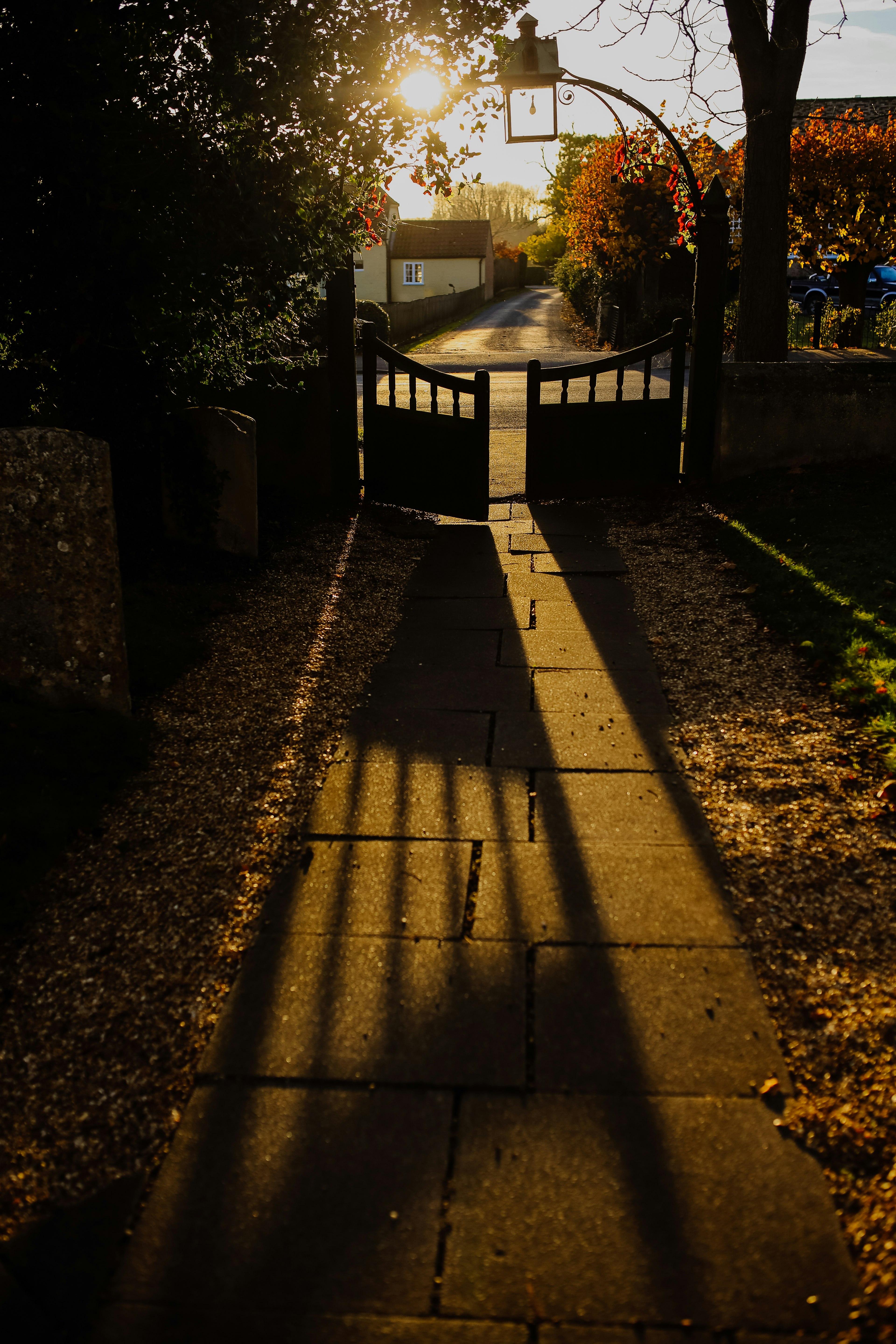 opened black gate with sunrays